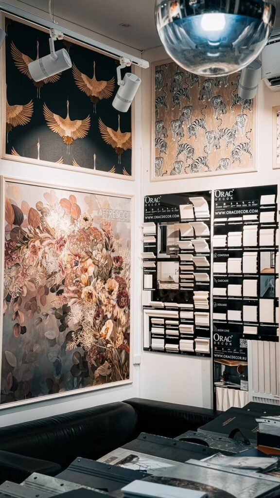 Photo by Bulat843 🌙 Artistic wall panels and decor in an interior design store, featuring floral and animal prints.